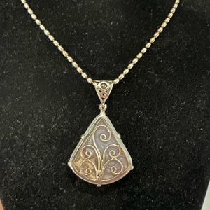 Starborn pendant with beaded silver chain.